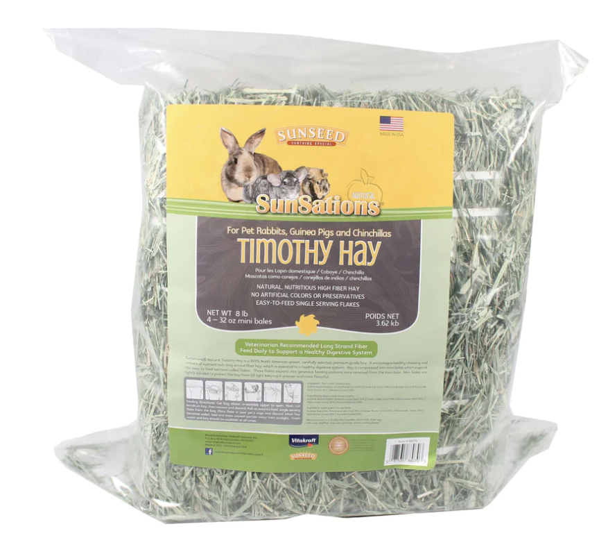 A bag with a green and yellow label filled with green timothy hay