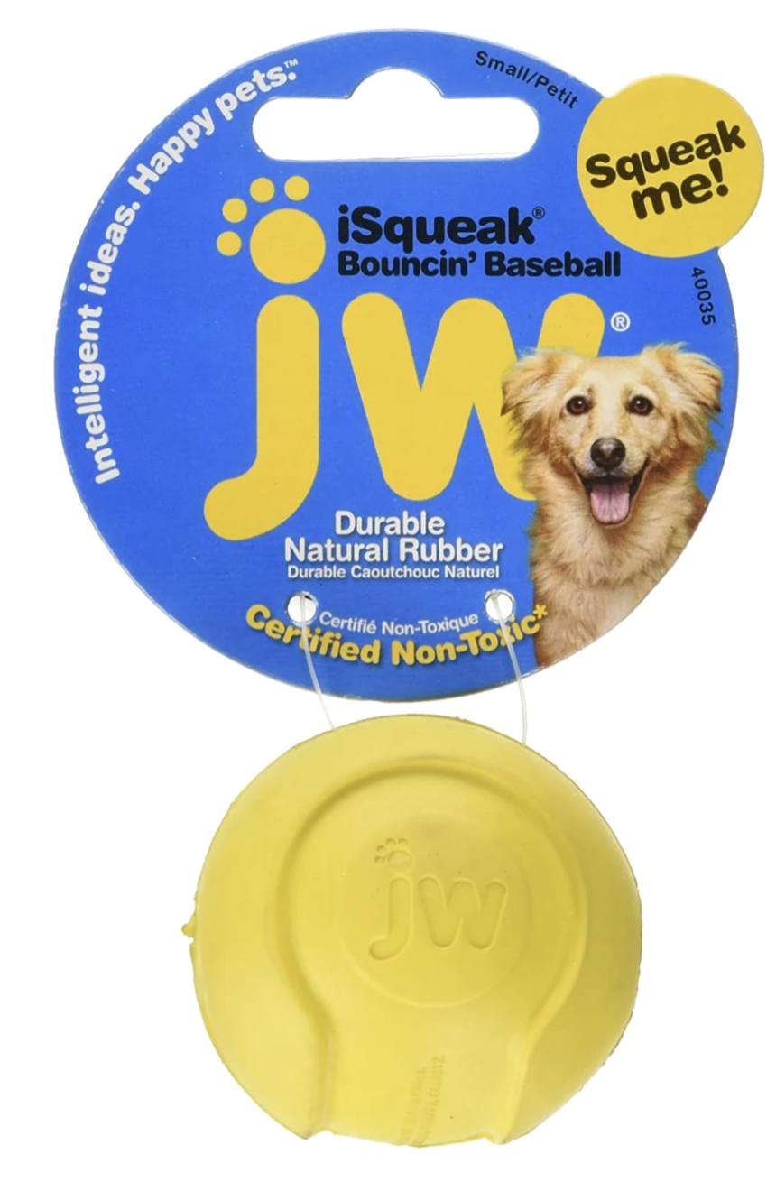 Small Yellow dog toy ball is attached to a blue cardboard package 