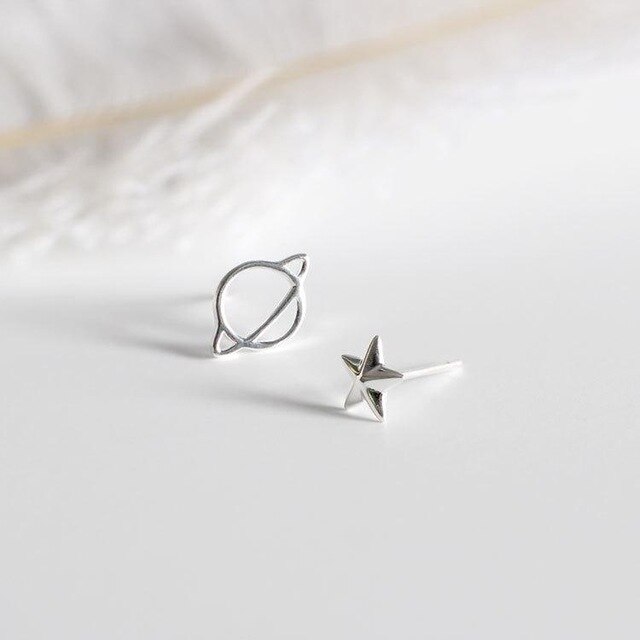 Mismatched planet stud earrings